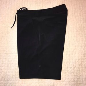 Men’s Lululemon black flat front shorts. Waist 32